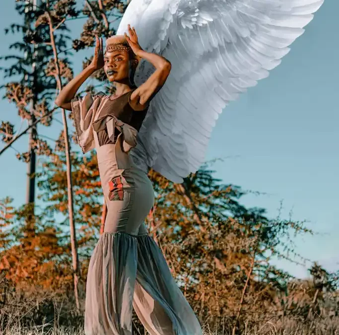 Goddess black woman with wings.